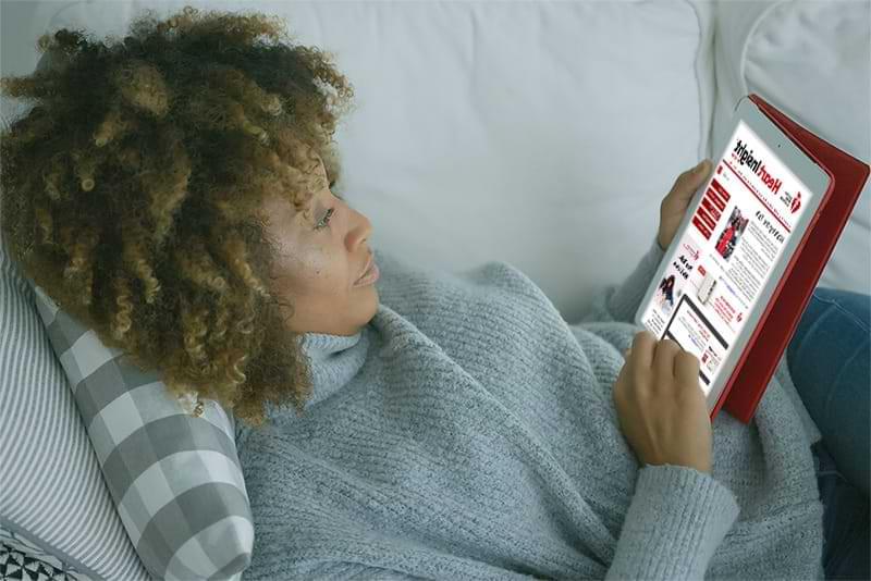 Woman reading Heart Insight on tablet