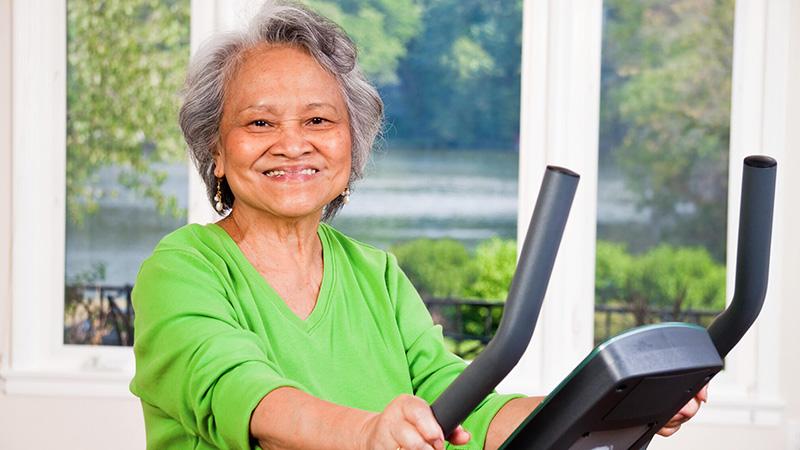 senior woman on treadmill portrait